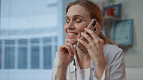 happy doctor discussing diagnosis looking x-ray closeup. smiling woman talking