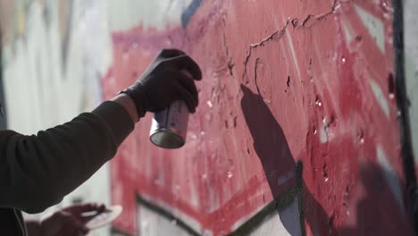 writers painting graffiti on wall. slow-motion