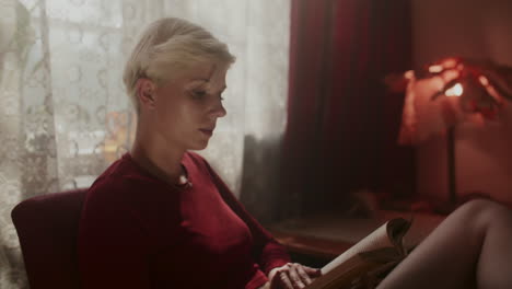 woman reading in a cozy interior