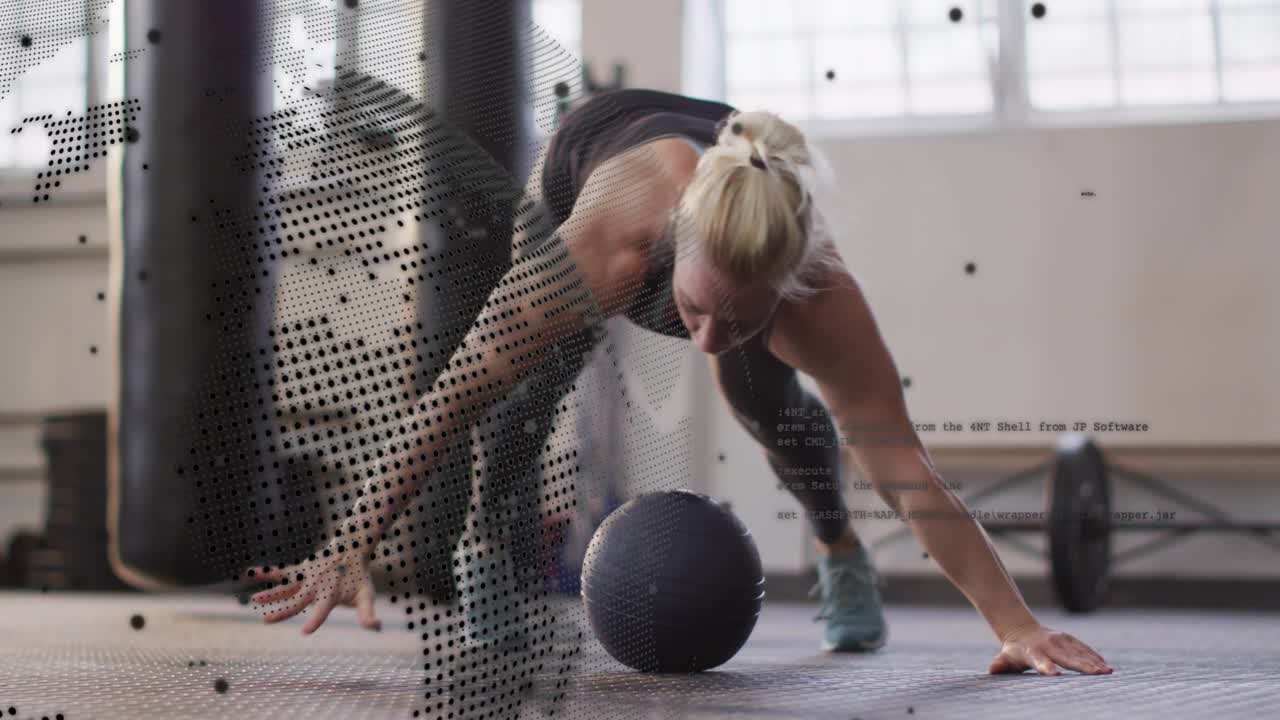 Starting low plank, woman shifting onto med ball doing alternating crossbody push-ups for fitness