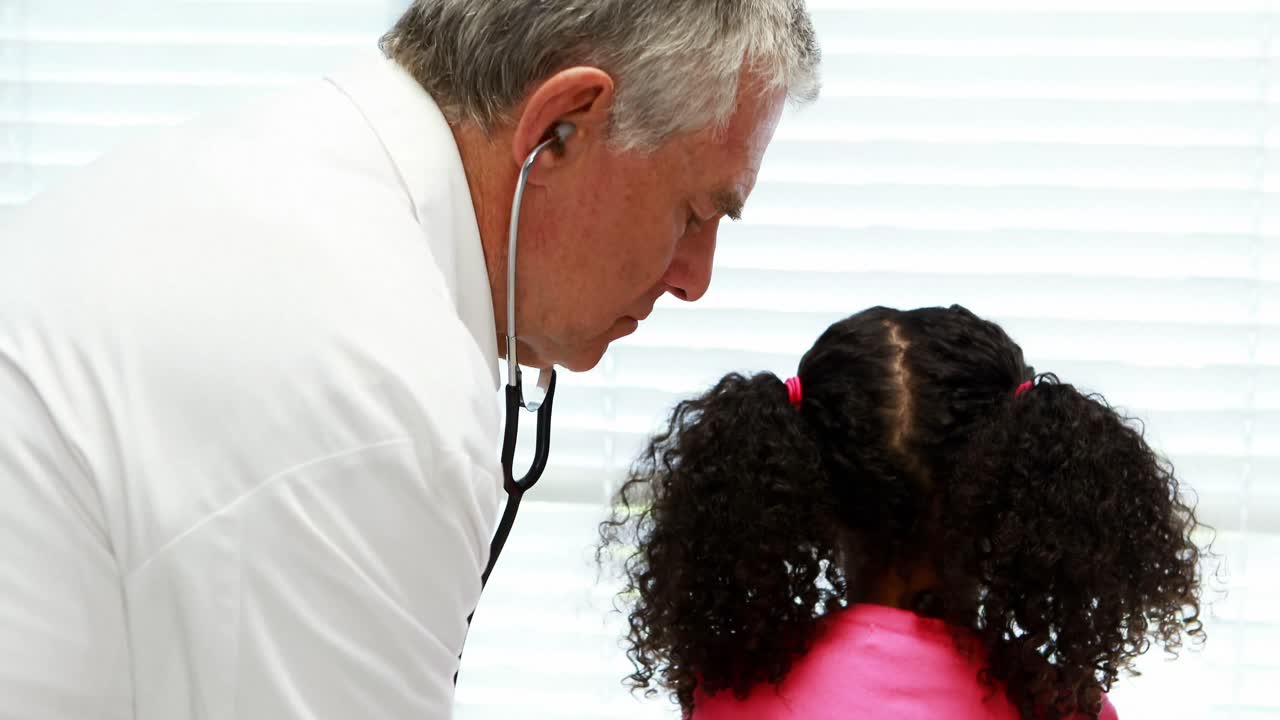 Male doctor examining a patient