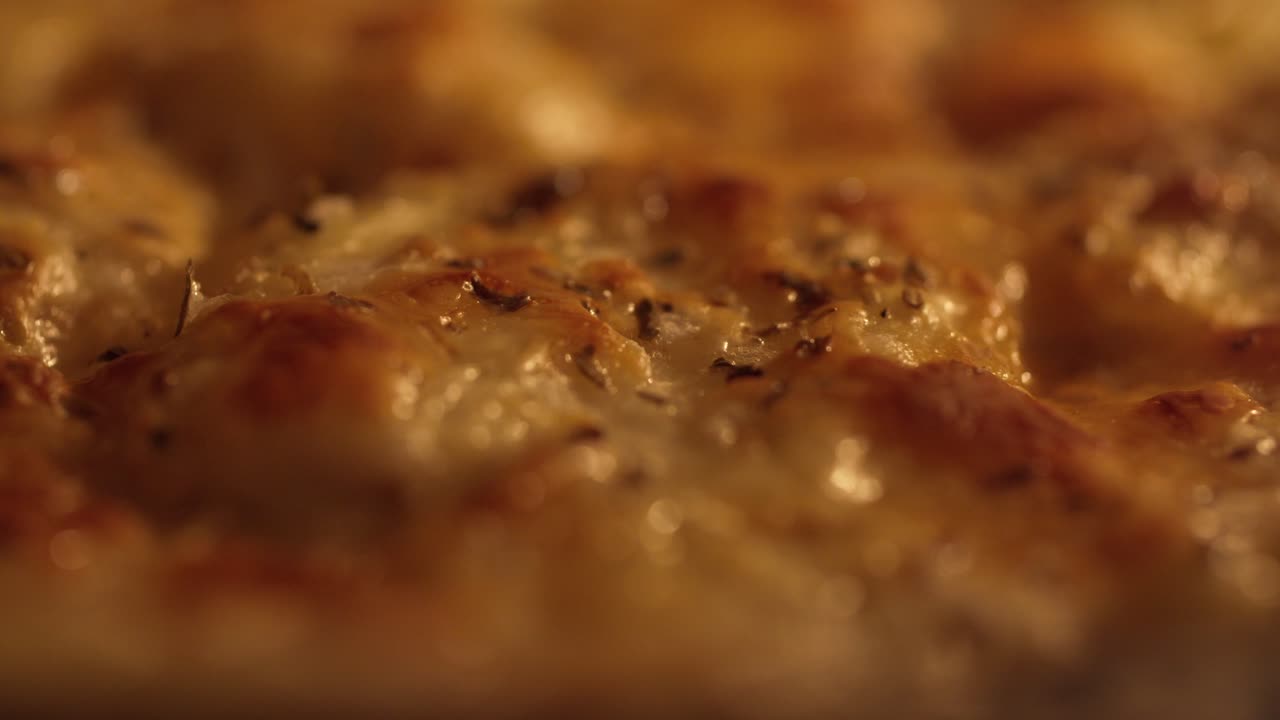 Golden, bubbling cheese pizza baking in the oven with a crispy, melted surface