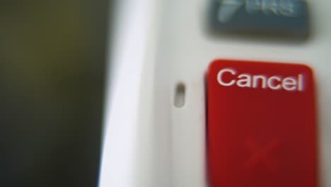 a macro close up shot of a pin pad numbers and letters on colorful buttons, smooth slide right movement, full hd video, super slow motion, blurry depth of field