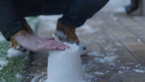 grandfather and granddaughter having fun in the snow