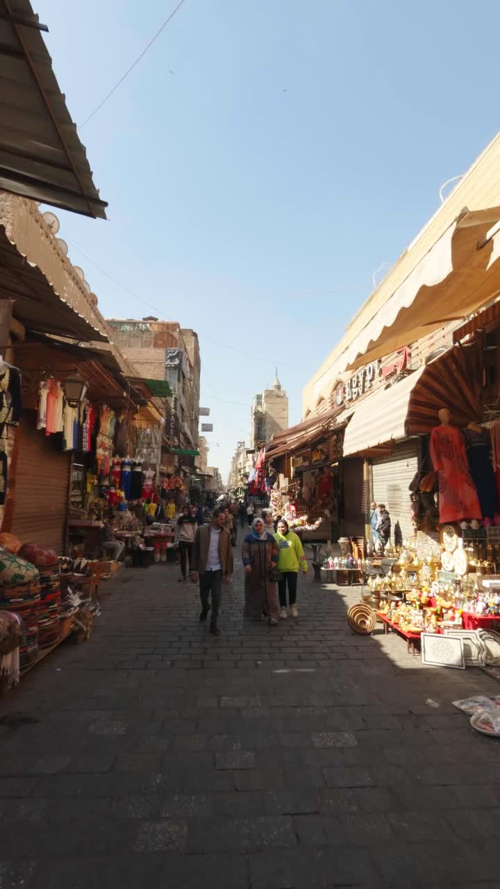People Walking Through a Bustling Traditional Street Market