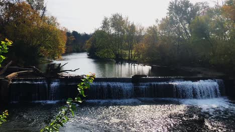 Waterfall-reflections-by-a-Mill-with-fall-leaves-changing-colors