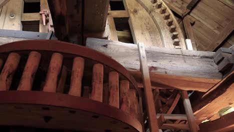 operating wooden sprocket system of an old corn mill