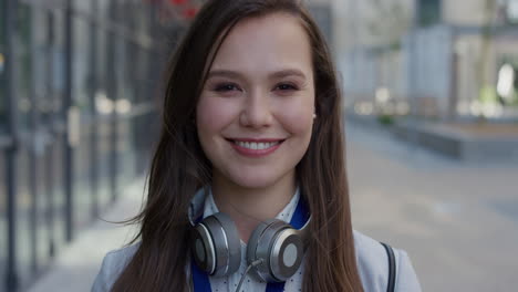 portrait young lively business woman intern smiling excited enjoying professional urban lifestyle success in city slow motion corporate student