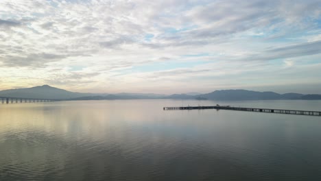 aerial tracking left around pier near richmond bridge from point molate beach richmond california usa