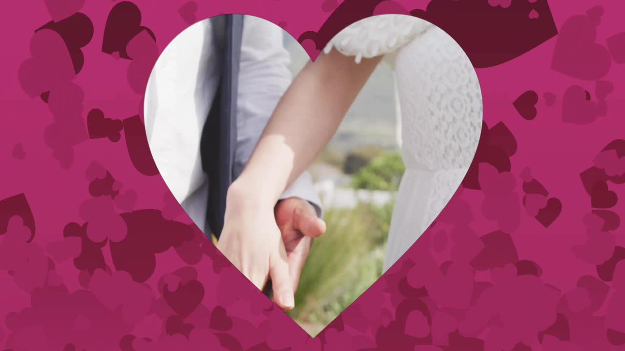 teniendo las manos, pareja en traje de boda sobre animación en forma de corazón con corazones rosados