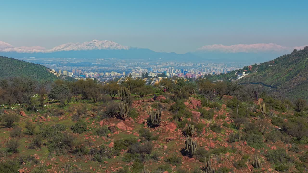 Aerial Drone fly Andean Hill Summit in Santiago de Chile with City background, Cerro del Medio