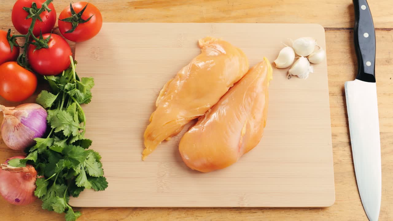 Raw Chicken Breast with Vegetables and Ingredients for Cooking