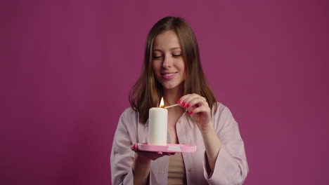 woman lighting a candle