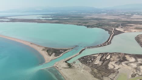 aerial view of serene turquoise lagoon with sandy beaches and pathways