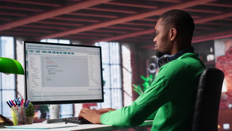 tech savvy black engineer developing secure online program at home