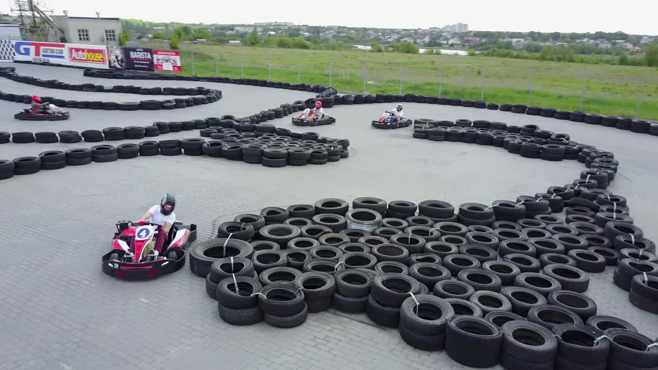 People Racing In Karts. VINNITSA, UKRAINE - MAY 2017: Europe Day, people driving karts on a kart track