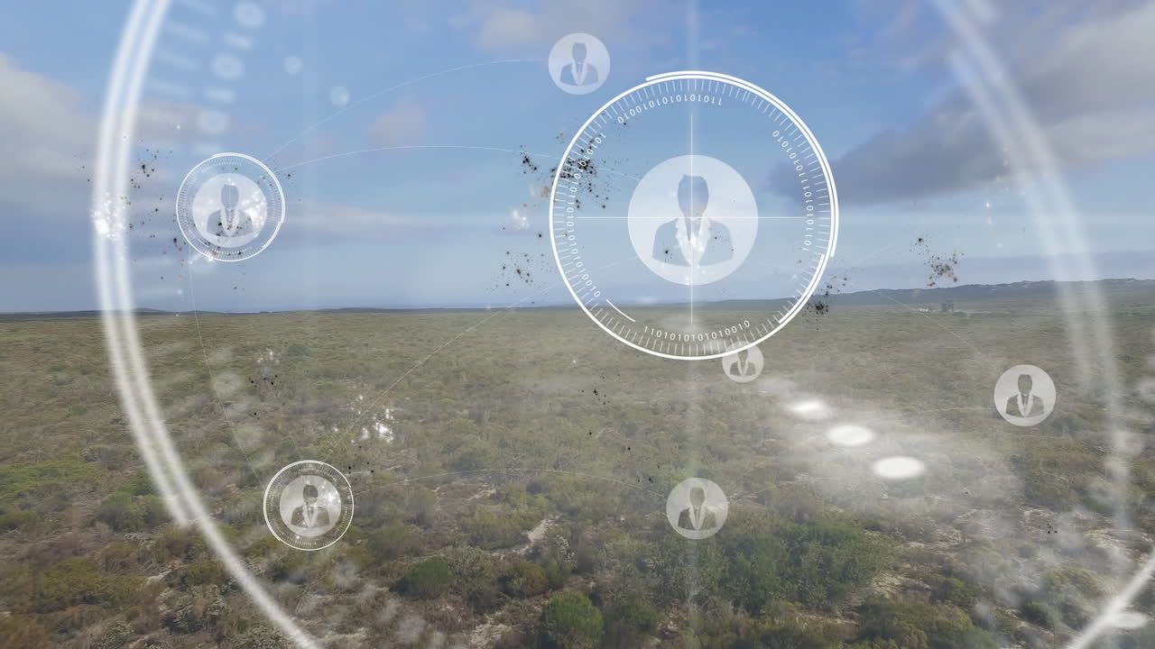 Floating translucent digital HUD and avatar icons with binary code over scrubland plain