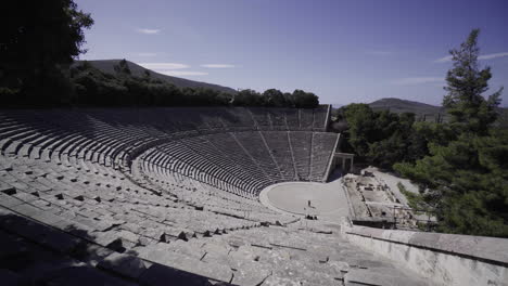 ancient theatre of the asklepieion at epidaurus situated in cynortion mountain in epidaurus, greece.  - panning shot