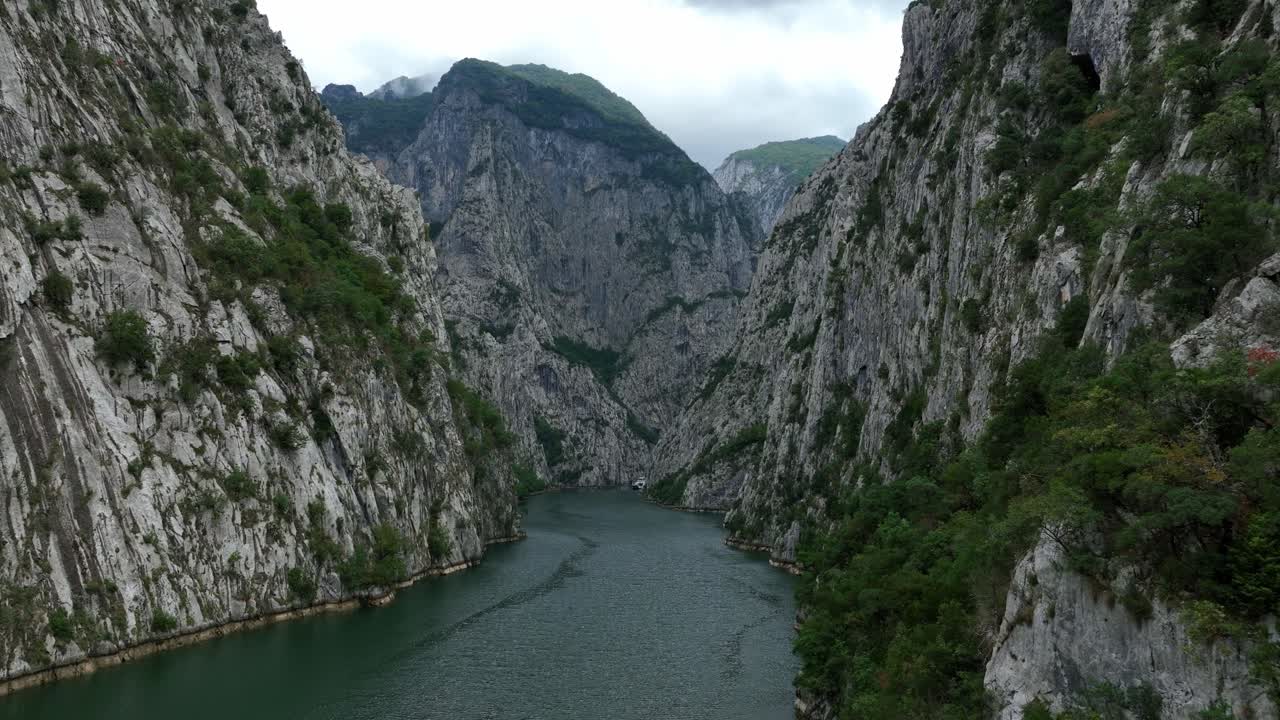 Komani Lake, Narrow Gorge Steep Vertical Rock Walls, Aerial Dolly In