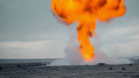 massive explosion with fire and smoke in an open field
