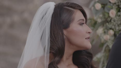 close up shot of bride smiling during wedding ceremony