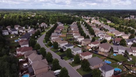 drone tilts over a suburban neighborhood on a perfect day.