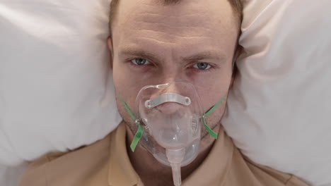 caucasian man with oxygen mask