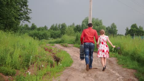 couple walking on country road