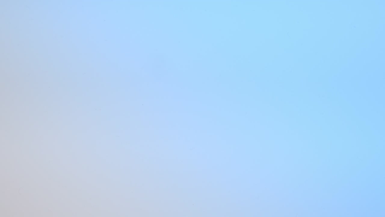 Top view of drop falls into water and diverging circles of water on blue background