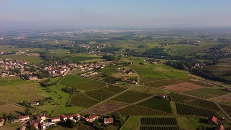 Drone-fly-over-the-vineyard-hills-at-sunset-in-villefranche-Beaujolais,-red-wine-production