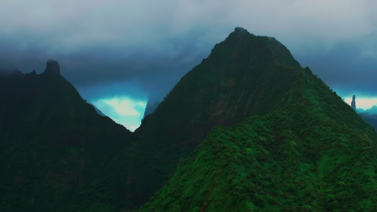 Cloudy morning towering jagged mountain peaks Vallee de Tautira River Tahiti island French Polynesia aerial drone Valley Bay Teahupoo Mont Rauiri Aorai Taiarapu Taravao right pan parallax motion