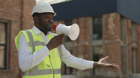 construction worker using megaphone on a construction site