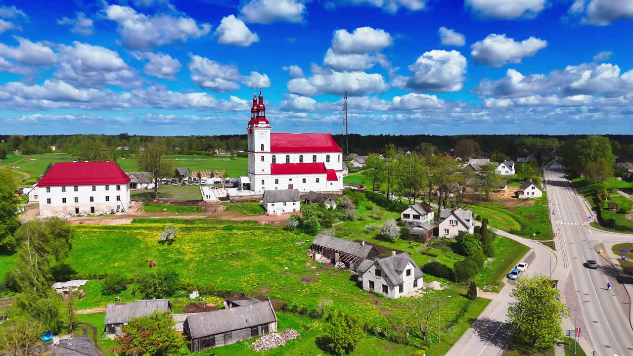 Church of the Assumption of the Blessed Virgin Mary At Skaistkalne Village In Bauska, Latvia. Aerial Drone Shot
