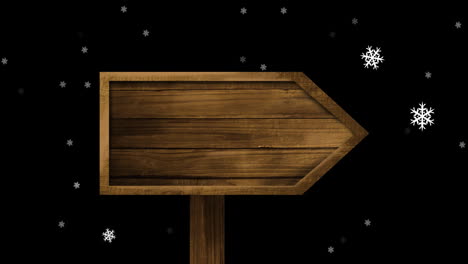 animation of wooden sign with copy space over snow falling