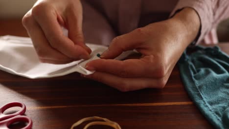 caucasian woman making her face mask