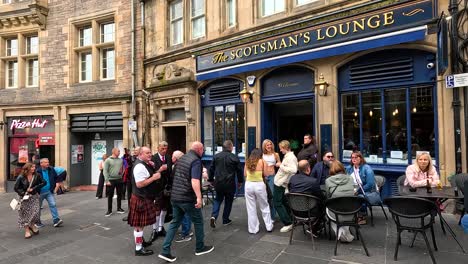 people socializing outside the scotsman's lounge