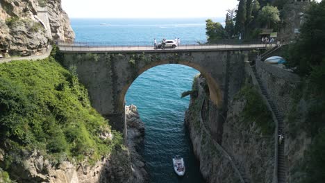 fixed aerial view of bridge over fiordo di furore in amalfi coast, italy