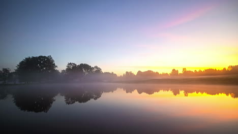 timelapse showcasing a rural landscape with a serene lake and house transitioning through the four seasons featuring snow, colorful leaves, misty mornings, and vibrant sunrises and sunsets