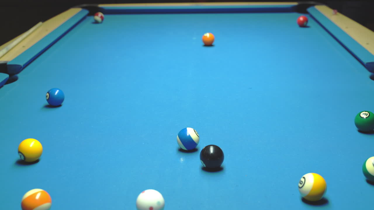 Billiard, kick off. Blue table, rolling balls