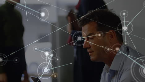 animation of network of connection over business people in the office