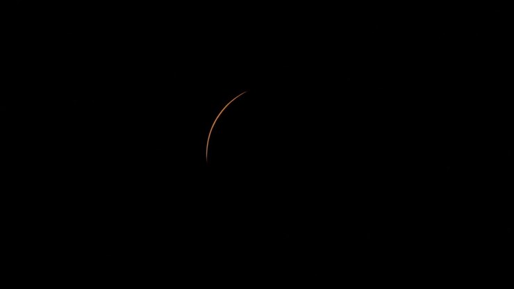 The last sliver of sunlight disappears as a total solar eclipse begins