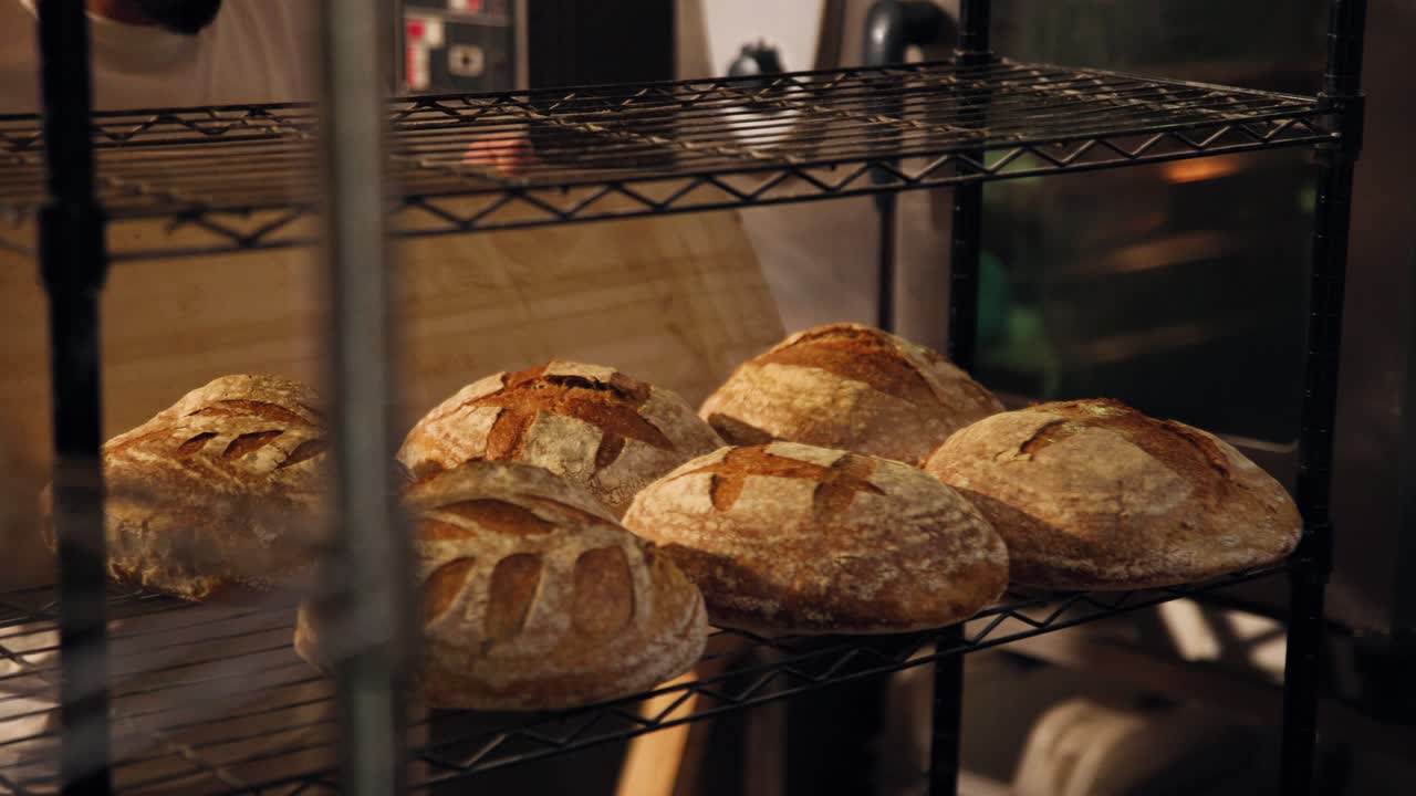 Freshly Baked Sourdough Bread Loaves Cooling on a Rack