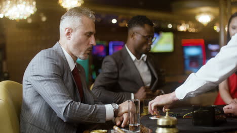 people playing poker at the casino.