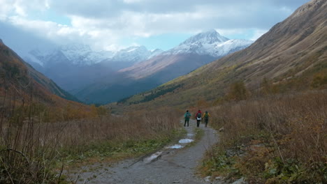 hikers in autumn mountain valley