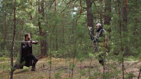 Mutiger-Ritter-Kämpft-Mit-Großem-Hässlichem-Ork-Im-Tannenwald