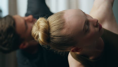 yogi couple practicing pose inverted triangle training together at home close up