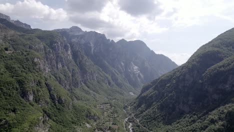 video with drone of lateral plane slider in the interior of the valley of theth in albania, on the river lumi i thethit with hardly any water