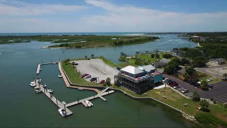 drone shot of intracoastal waterway on sunny day near ocean isle beach nc near shallotte nc