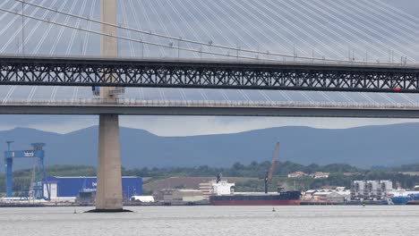 queensferry and forth road bridge with rush hour traffic, close-up