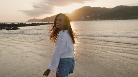 happy woman smiling at the beach